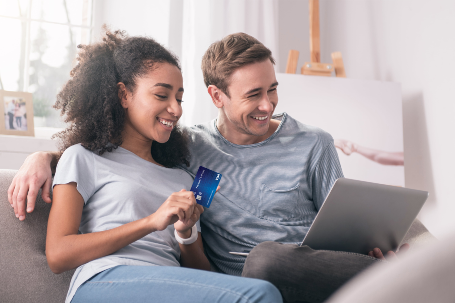 couple on laptop with SDFCU Premium Cashback+ Credit Card